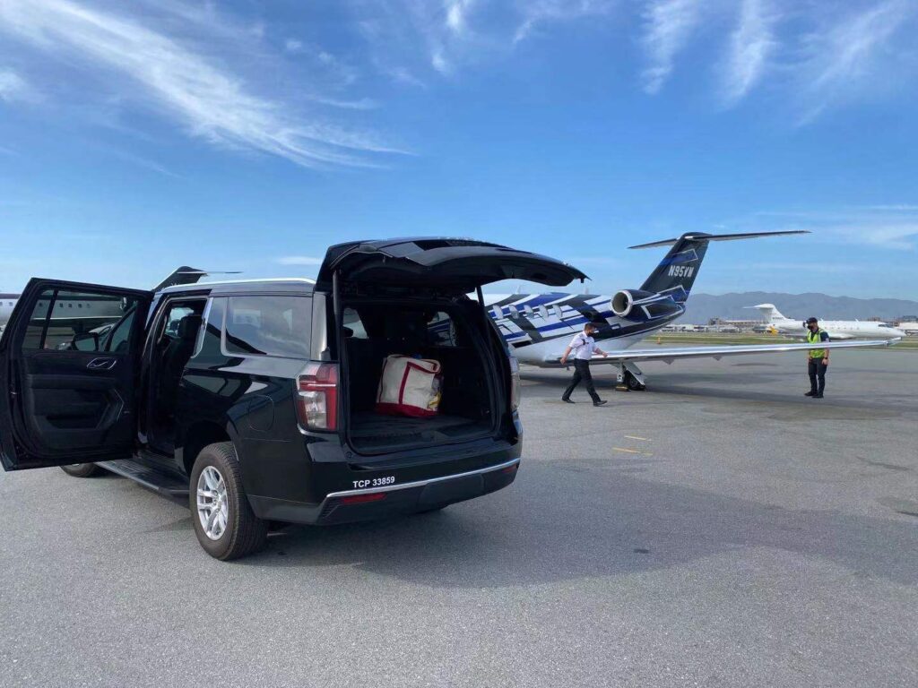 Black SUV with back open ifor private jet pickup